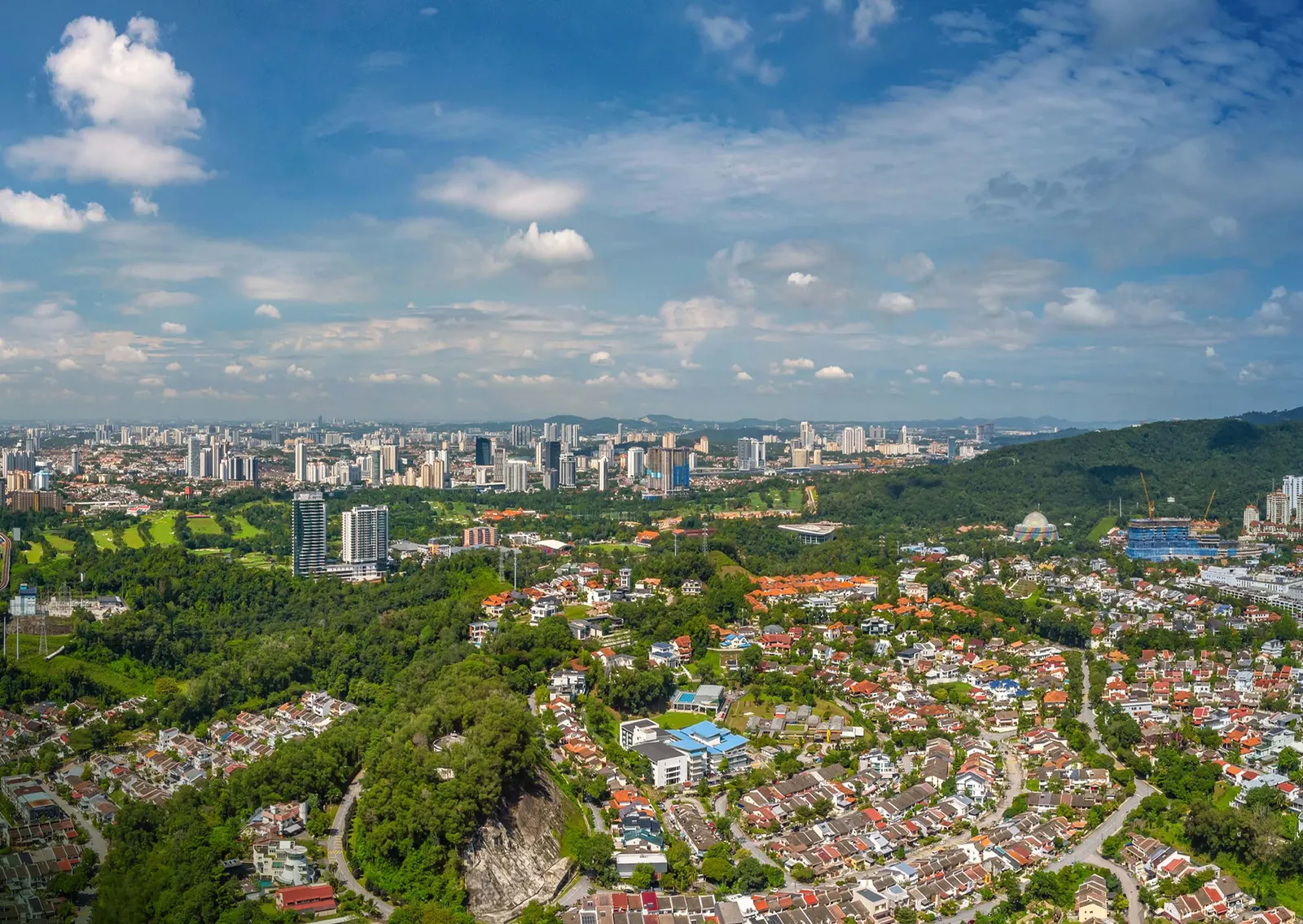 Aerial view of Bukit Kiara greenery surrounding Pavilion Damansara Heights